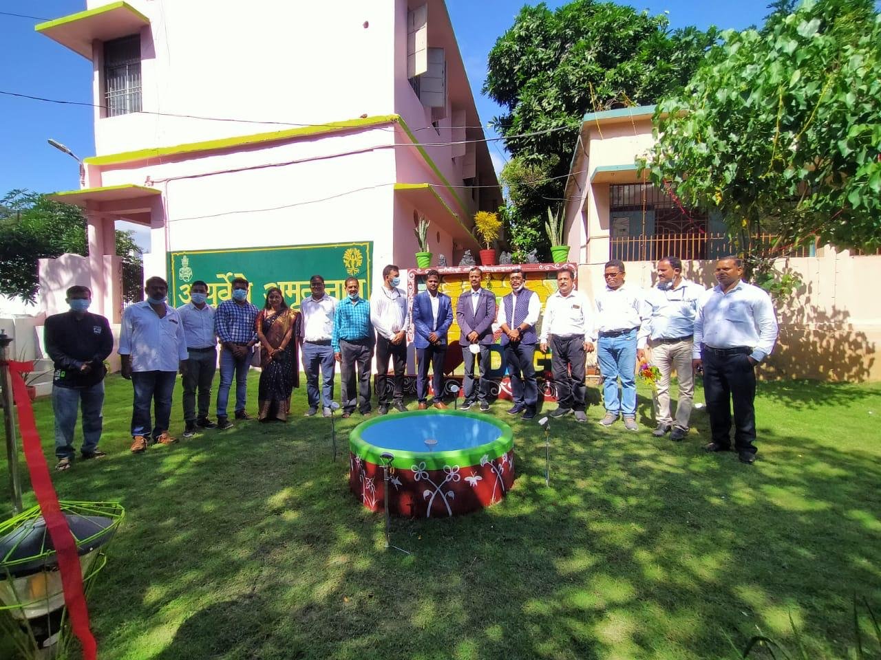 Faculty and staff at the campus garden